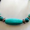 Magnesite beads with antiqued silver plated spacer beads on a velvet cord

19 cm expands to 25 cm

Silver plated clasp