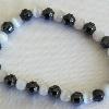 Hematite and Cat's Eye Glass stretch bracelet

17.5 cm (stretches)