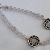 Aurora Borealis glass beads with antique silver-plated braid focals

20 cm

SIlver plated clasp
