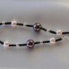 Purple and pink glass pearls combined with silver spacer beads and Czech glass bugle beads

19 cm

Silver plated clasp
