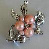 Pink glass pearls (3.5 and 7.5 mm) and Austrian crystals with a flower accent design

40x30 mm

Silver plated