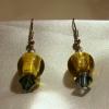 Green-tan and dark blue Lampwork Glass earrings (23mm drop)

Bead sizes 8mm, 12mm

Silver plated