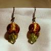Gold and green Lampwork Glass earrings (22mm drop)

Bead sizes 8mm, 12mm

Silver plated