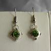Green Swarovski Crystal earrings (15mm drop)

Bead size 8x5mm

Antique silver plated