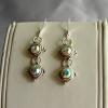 Aurora Borealis Swarovski Crystal earrings (25mm drop)

Bead size 8x5mm

Antique silver plated