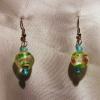 Blue-green Lampwork Glass earrings (23mm drop)

Bead sizes 4mm, 12mm

Silver plated