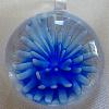 30mm Lampwork Glass pendant with flower design inside

Weight 12.4g

Bail is formed as part of the glass