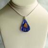 25x15mm Lampwork glass teardrop pendant

Weight 1.9g

.925 Sterling Silver bail