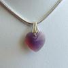 10mm Swarovski Cyclamen-cut heart pendant

Weight 2.5 ct

.925 Sterling Silver bail