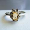 7x5mm Citrine set in Sterling Silver flower design ring

Citrine weight 1.2 ct

ring size 8